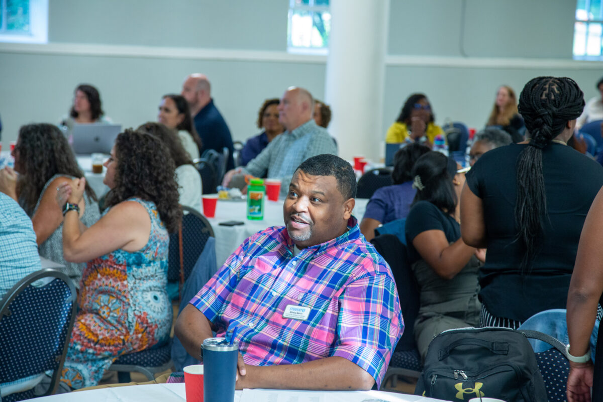 Conference photo of NC Community Coalition members with Mikasa Melvin